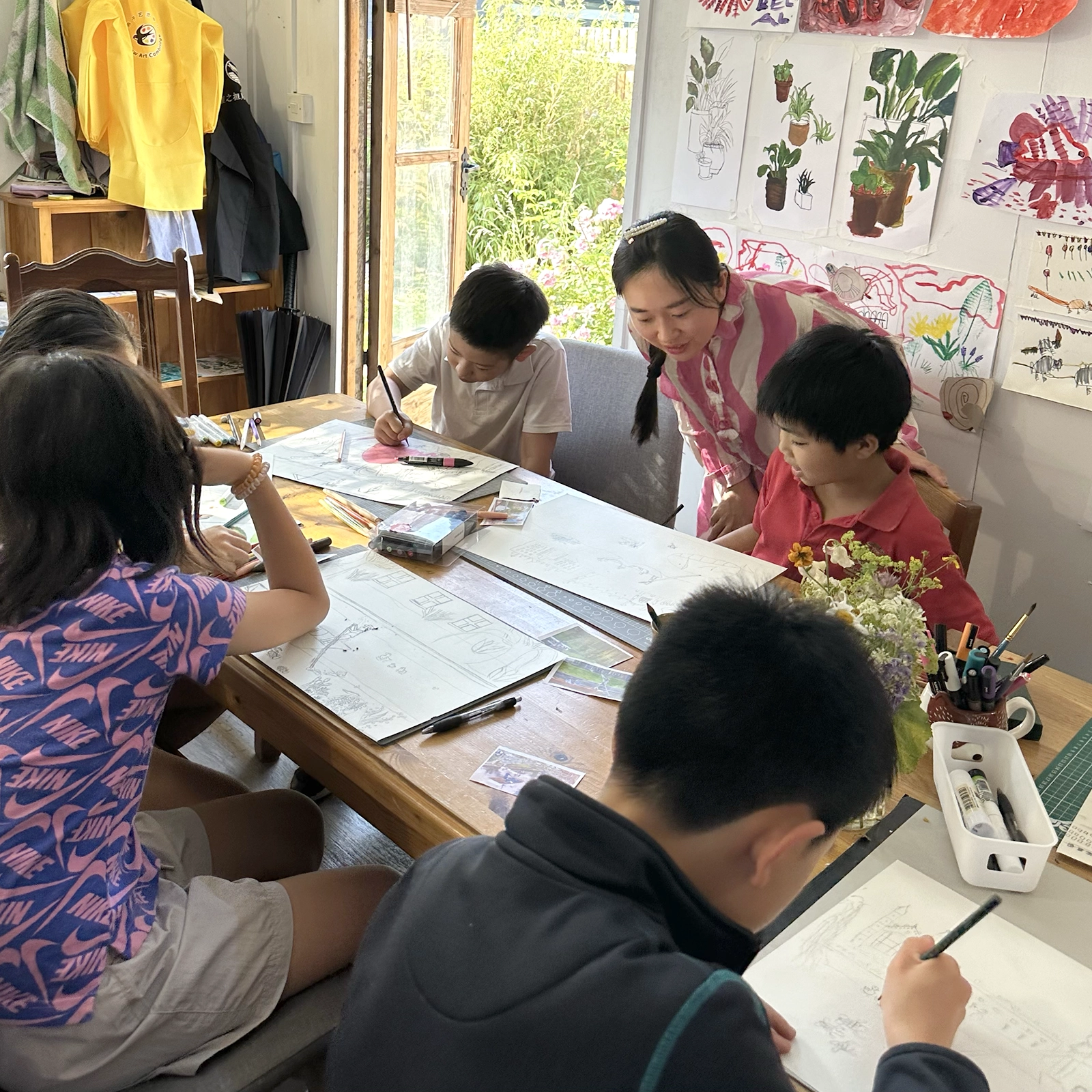 Children working on drawings in a weekly art class at Swallow Art Cambridge